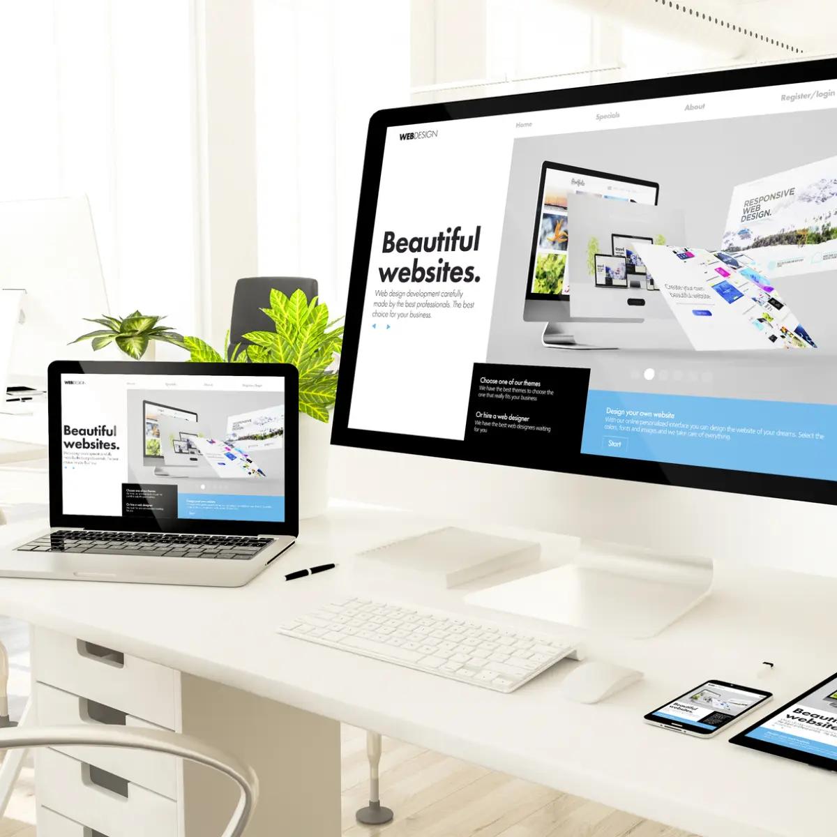 A premium website design on an elevated laptop and desktop computer.