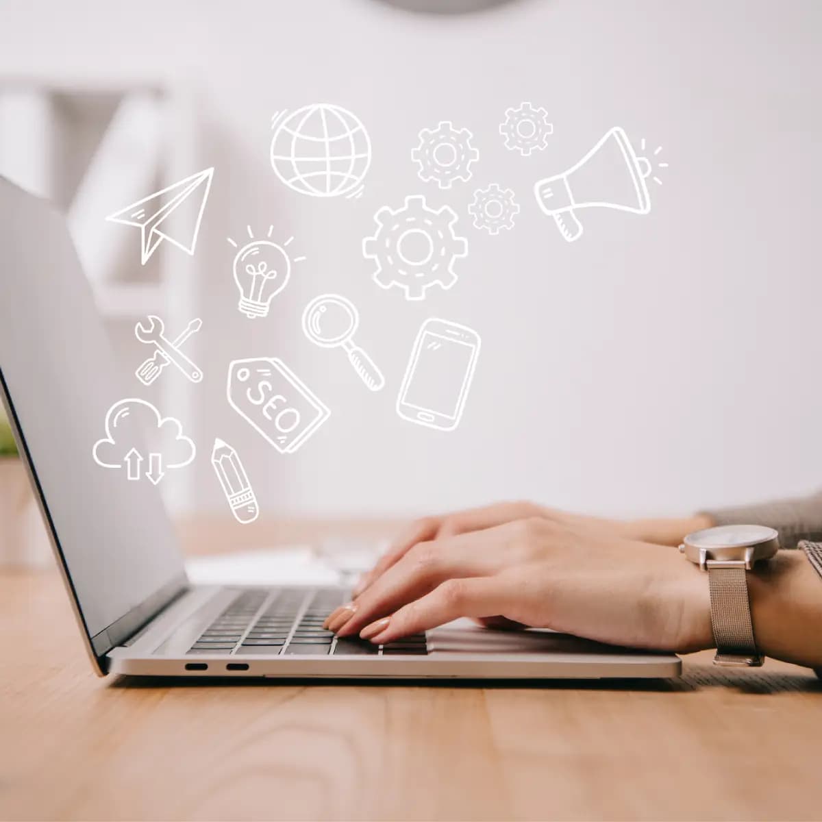 A woman is typing on a premium laptop with icons flying around it.